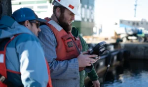 2 workers using BRIDGE controller to operate ROV